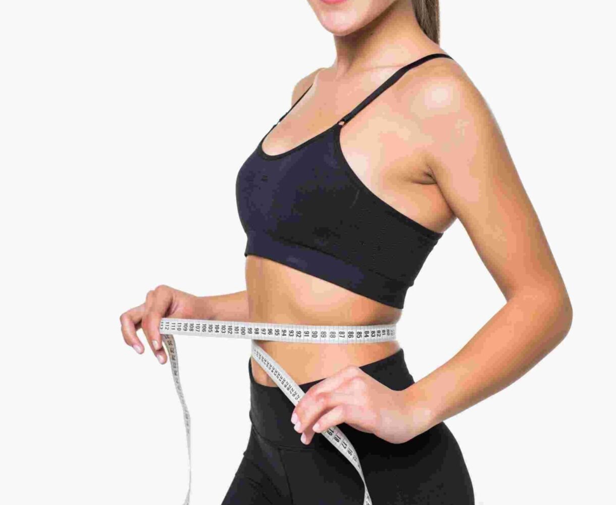 young-fitness-woman-measure-with-tape-her-belly-isolated-white-wall (1)